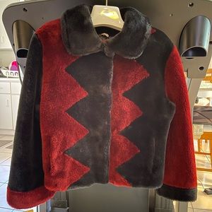 This is a faux fur shirt jacket.  Size medium, 42” bust. Burgundy/black. new.